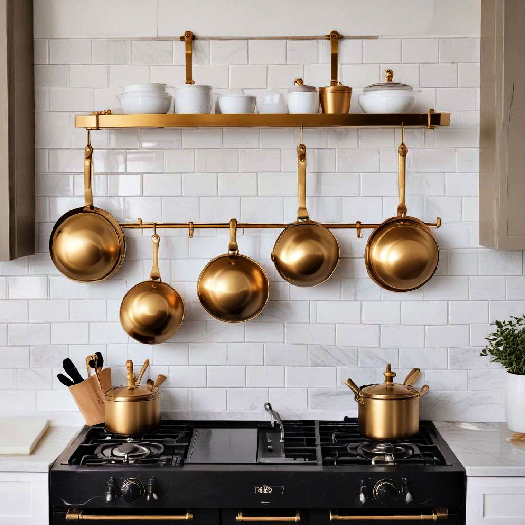 gold pot rack against a white backsplash