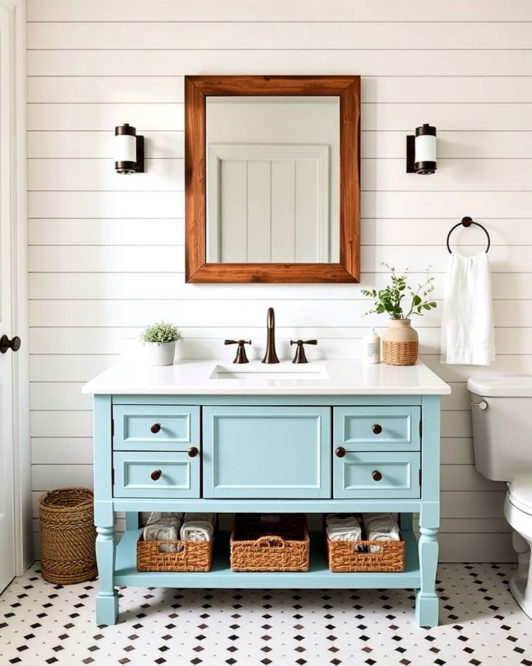 aqua blue vanity with shiplap walls