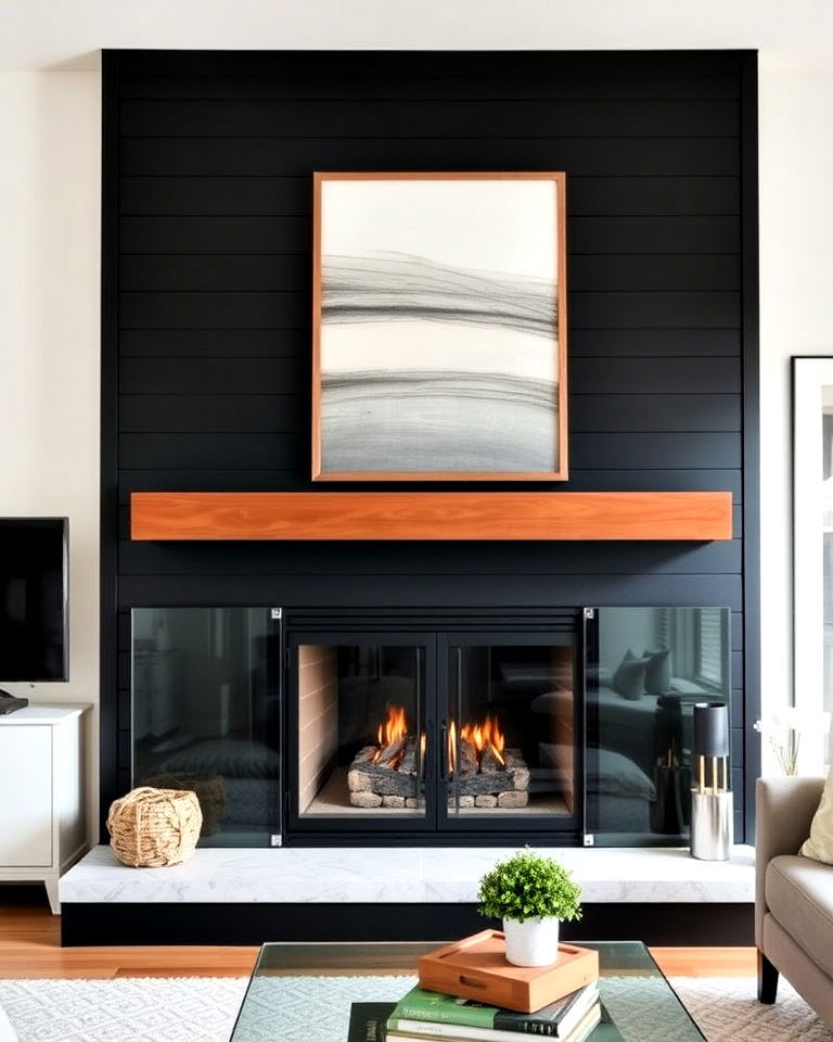 black shiplap fireplace with glass doors
