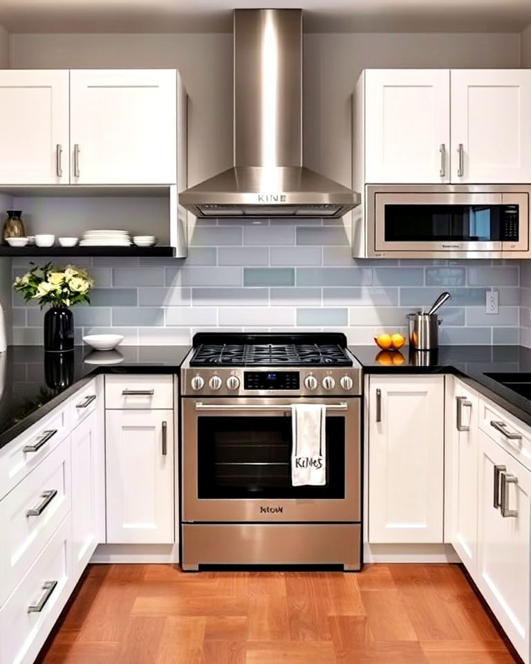 contemporary kitchen with white cabinets and black countertop