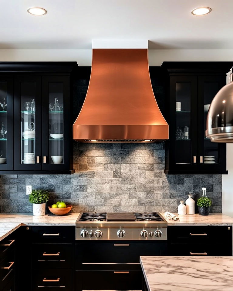 copper vent hood with black cabinets