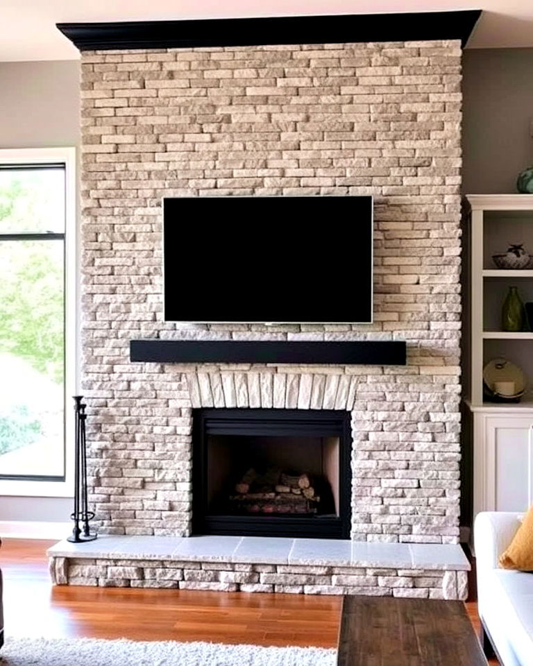 faux stone fireplace with black surround