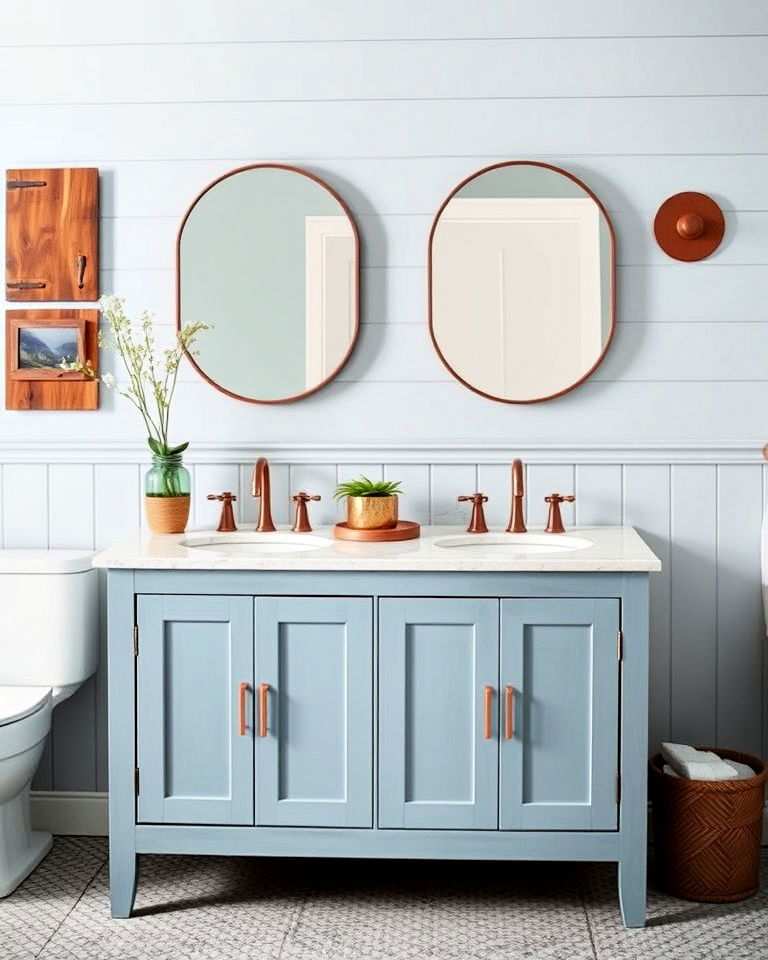 muted blue vanity with copper fixtures