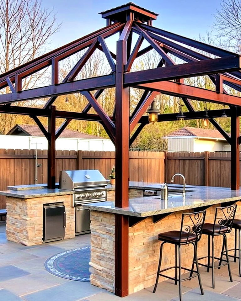 rustic metal gazebo with stone bbq and bar counter