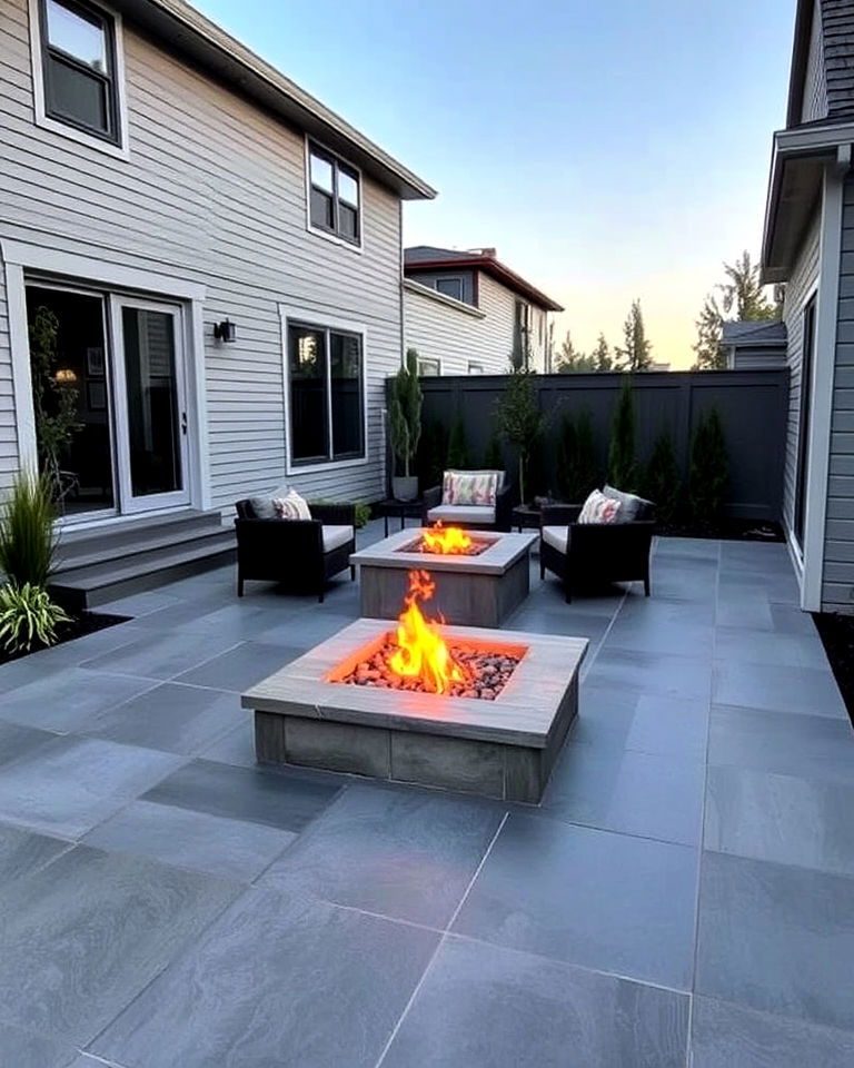 slate inspired stamped patio with a low profile fire pit