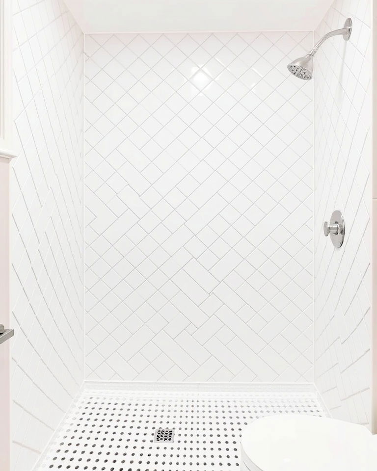 white tiles bathroom in a diamond layout for a unique twist