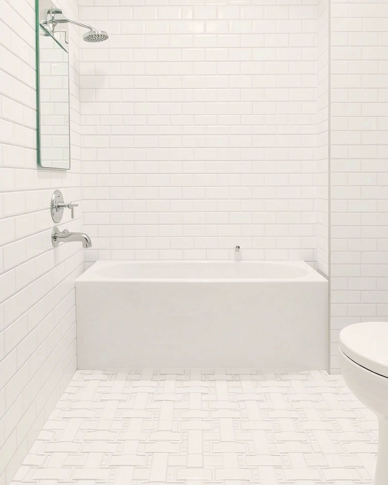 white tiles in a basketweave pattern bathroom
