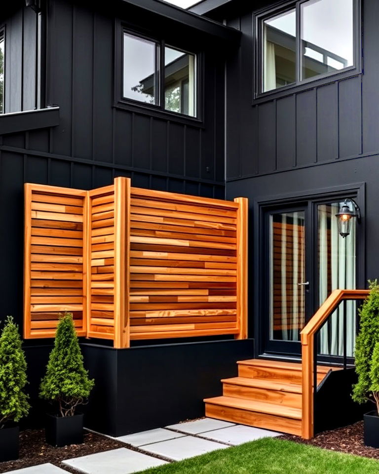 black exterior walls with cedar privacy screens