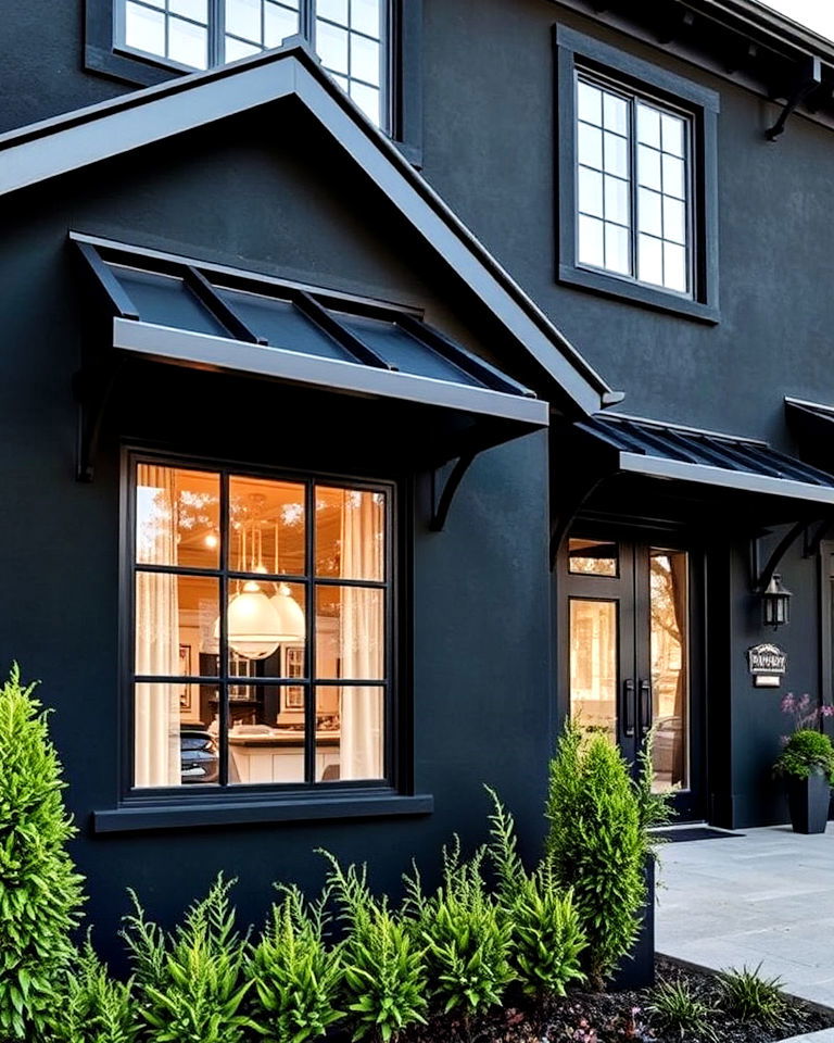black stucco with metal details exterior house