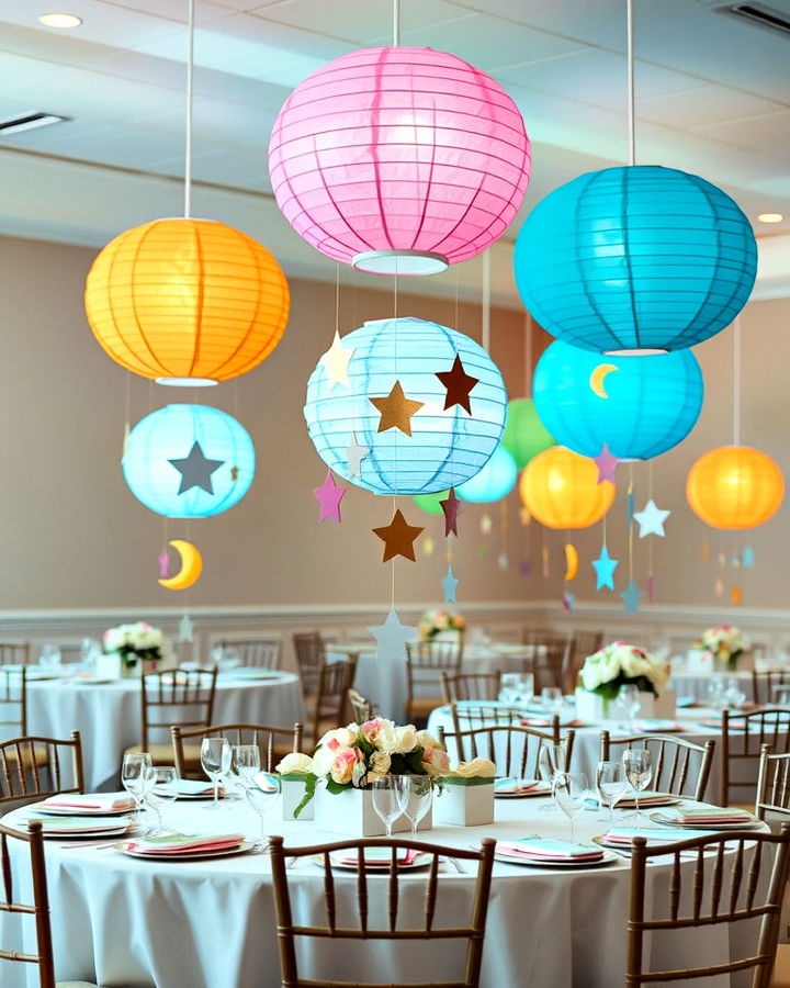 Paper lantern with suspended star strings as centrepiece for the baby shower.