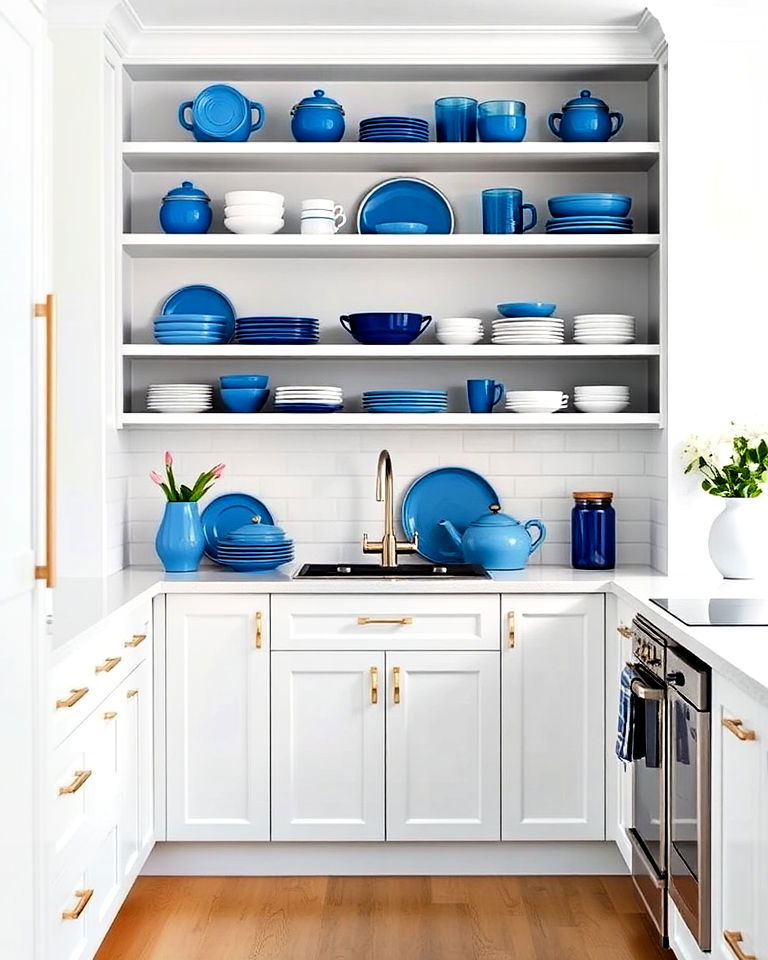 elegant white kitchen with stylish blue accessories