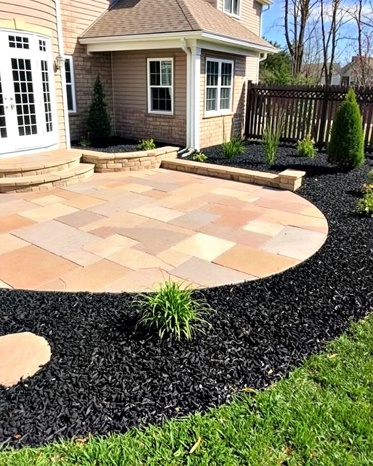 stylish black mulch stone patio surround