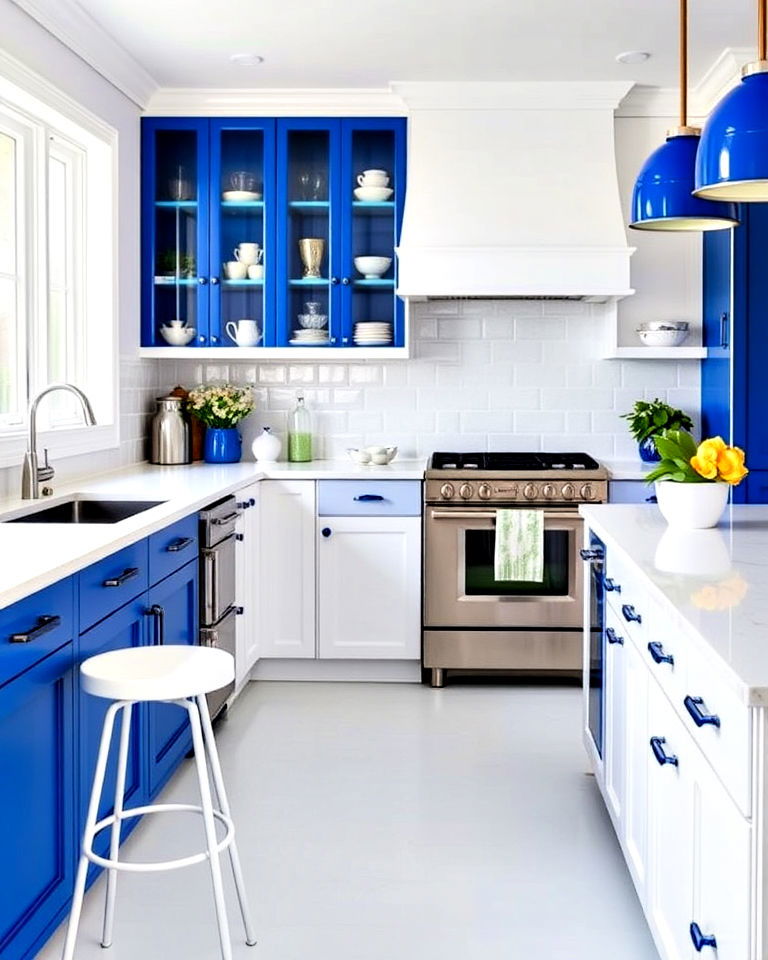 white kitchen cabinets with cobalt blue accents